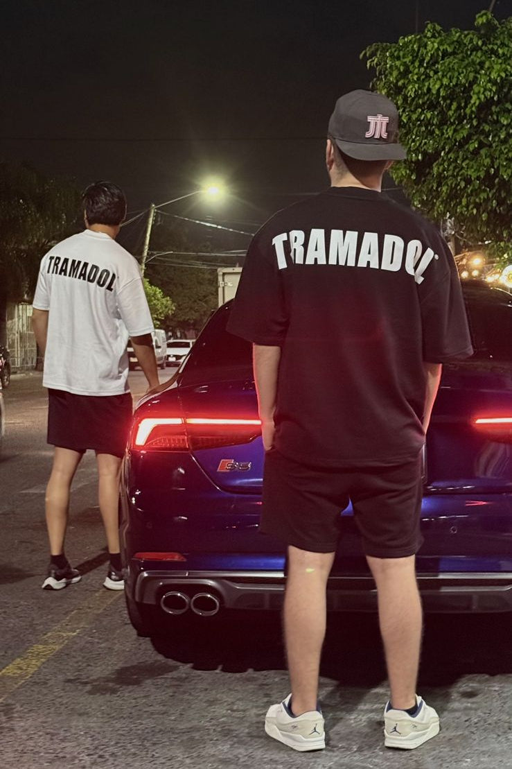 Back view of black and white TRAMADOL® t-shirts.